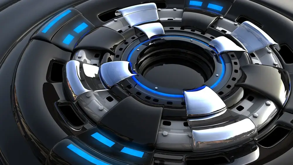 A futuristic, metallic circular structure with black and silver segments and glowing blue accents. It conveys a sleek, technological, and modern feel.
